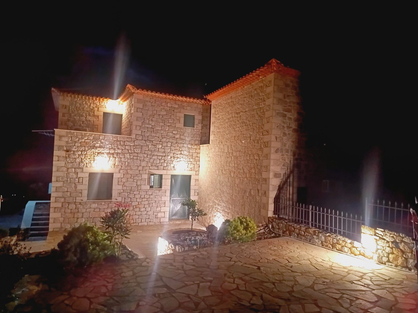 The house lit up in the evening